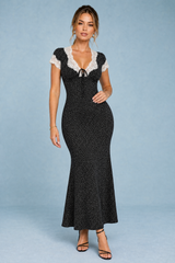 Vestido negro de lunares con borde de encaje