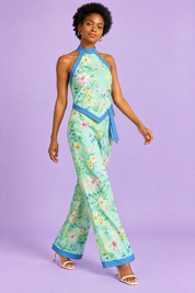Combishort asymétrique vert menthe à imprimé floral et encolure dos nu | Vue en mouvement | Lounelle Paris