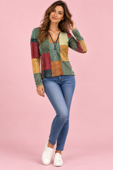 Top verde con estampado patchwork y cremallera