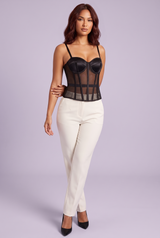 Top corsé negro con paneles transparentes