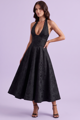 Vestido midi negro de corte evasé con encaje floral y escote en V