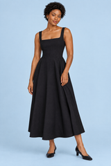 Vestido midi negro de tirantes y bajo con volumen