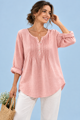 Blusa rosa de algodón con cuello redondo y pliegues