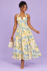 Vestido amarillo de flores y rayas con cuello halter