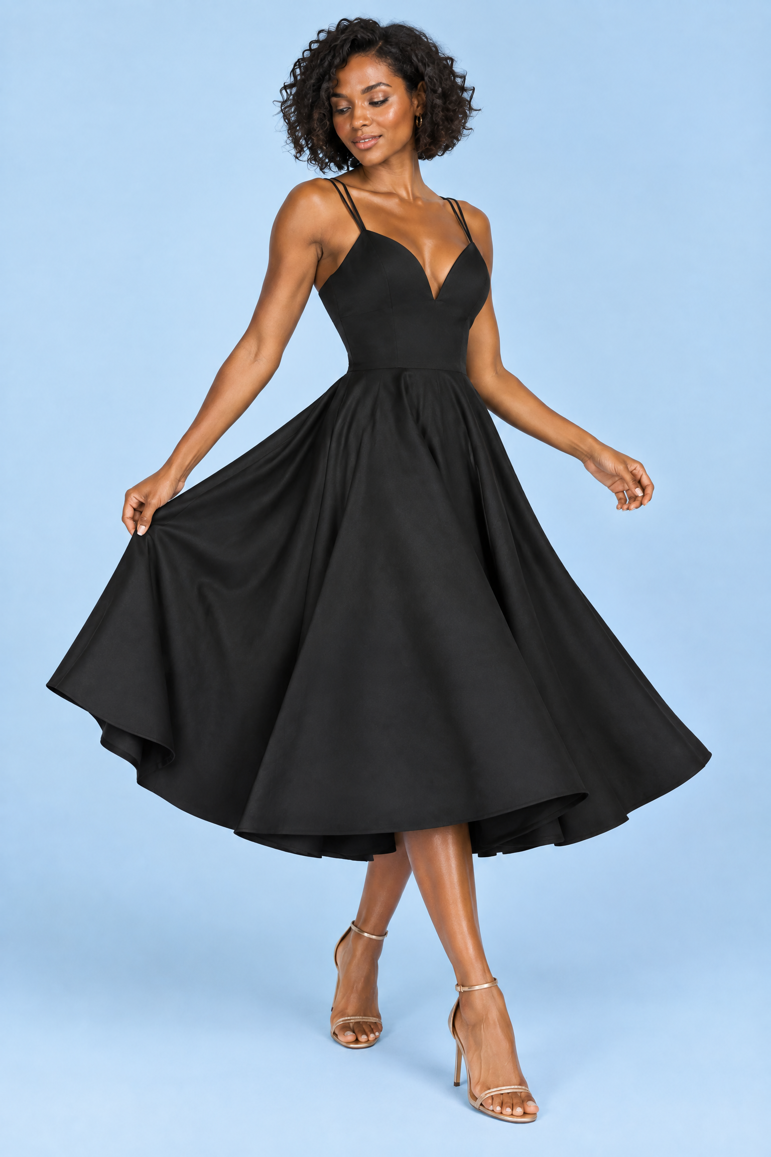 Robe midi noire à fines bretelles et jupe ample | Vue en mouvement | Lounelle Paris