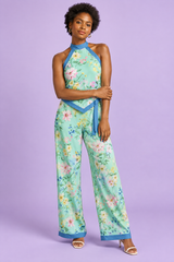 Mono corto asimétrico verde menta con estampado floral y escote halter