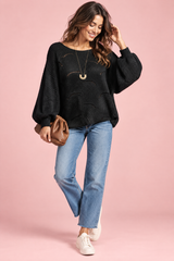 Jersey negro oversize de punto calado y escote barco