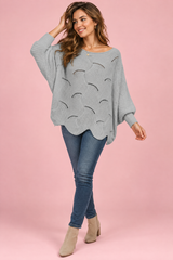 Jersey gris oversize de punto calado y escote barco