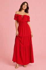 Vestido largo con volantes y hombros descubiertos